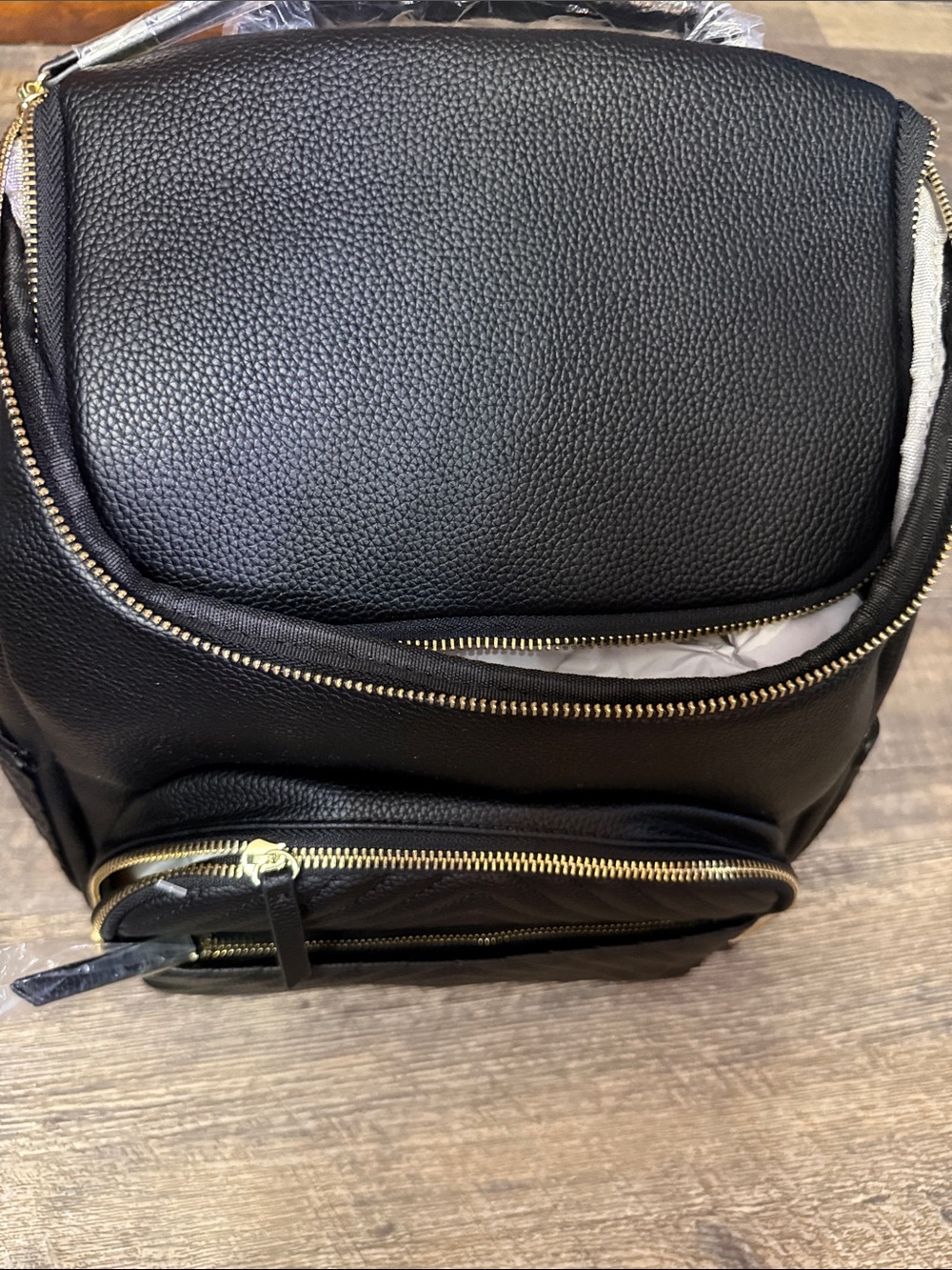 Black Pebbled  Backpack with Gold Zippers
